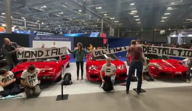 Eco-Activists Storm Paris Motor Show And Vandalise Supercars Including A $180,000 Ferrari Eco-Activists Storm Paris Motor Show And Vandalise Supercars Including A $180,000 Ferrari